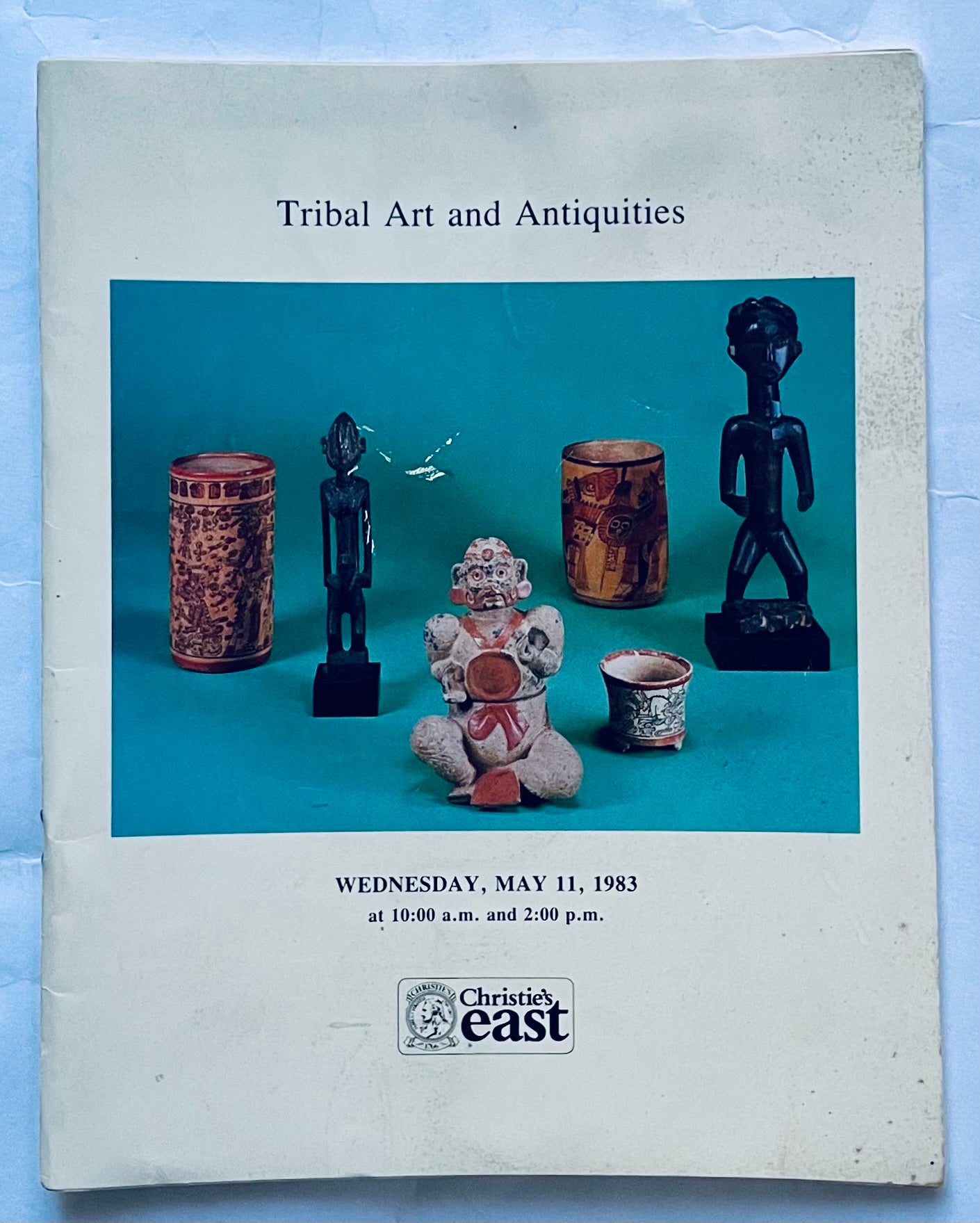 Vintage Christie's auction catalog Tribal Art and Antiquities May 11 1983 with tribal sculptures and pottery on cover